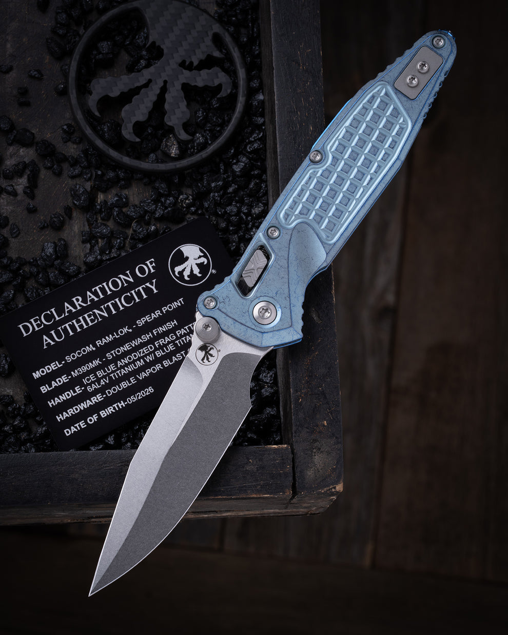 Microtech Gear Socom® RAM-LOK® – Spear Point Marfione Select Stonewash Finish Ice Blue Anodized Frag Pattern Titanium W/ Blue Titanium Accent Double Vapor Blast Stainless (160RL-10FRSMS7)
