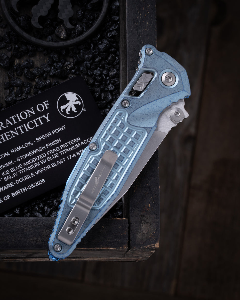 Microtech Gear Socom® RAM-LOK® – Spear Point Marfione Select Stonewash Finish Ice Blue Anodized Frag Pattern Titanium W/ Blue Titanium Accent Double Vapor Blast Stainless (160RL-10FRSMS7)